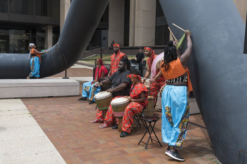 Sculptor Isamu Noguchi, Portal is a thirty-six-foot-tall black tubular steel sculpture outside the Cuyahoga Justice Center that was miked for sound and included a performance with Joe Namy and Djapo Cultural Arts.