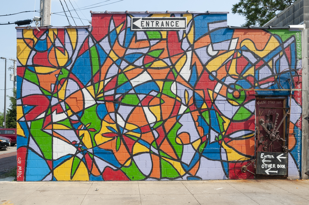 The vibrant Piet Mondrian-inspired mural painted on The Bubble Project’s exterior wall on Bridge Avenue