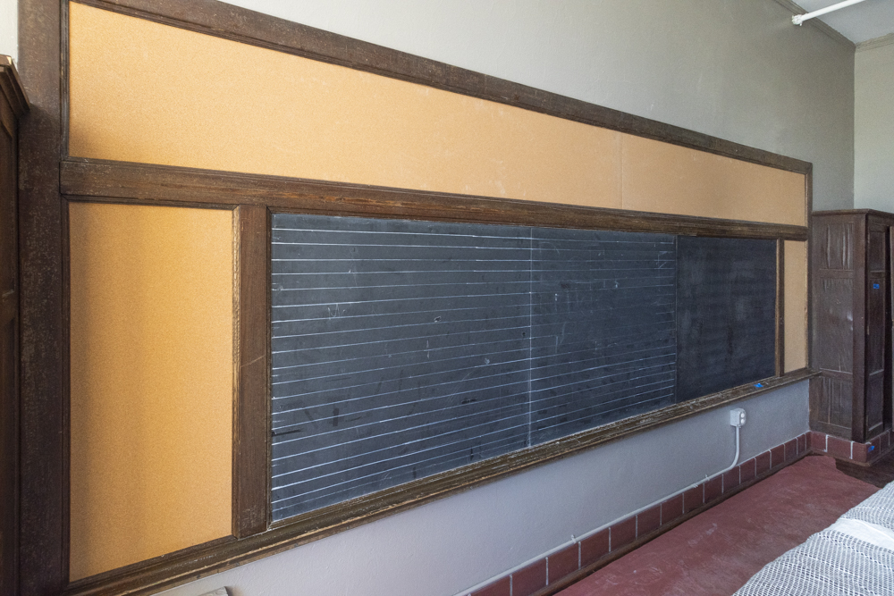 The original black boards from the former Longfellow Elementary School are featured in apartments in the old section of the complex.