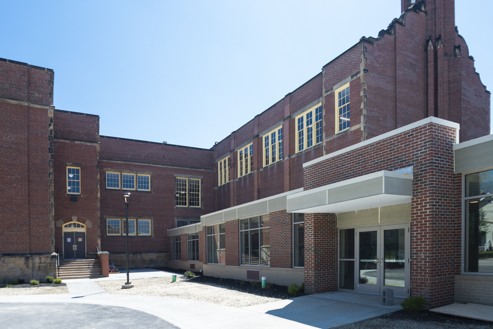 The new entrance of The Longfellow apartments with the old school section to the left