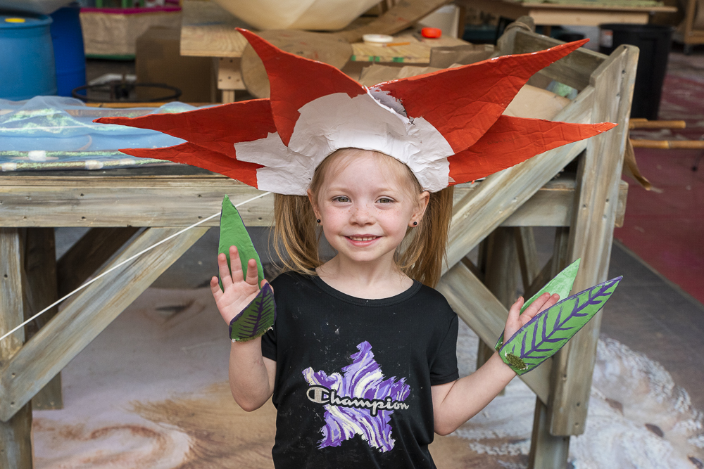 Lily Wischmeier demonstrates a costume made by her mom Ashley