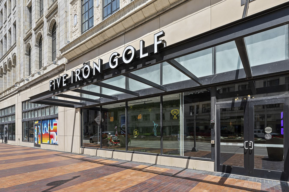 Five Iron Golf on the first floor of the Euclid Grand Apartments