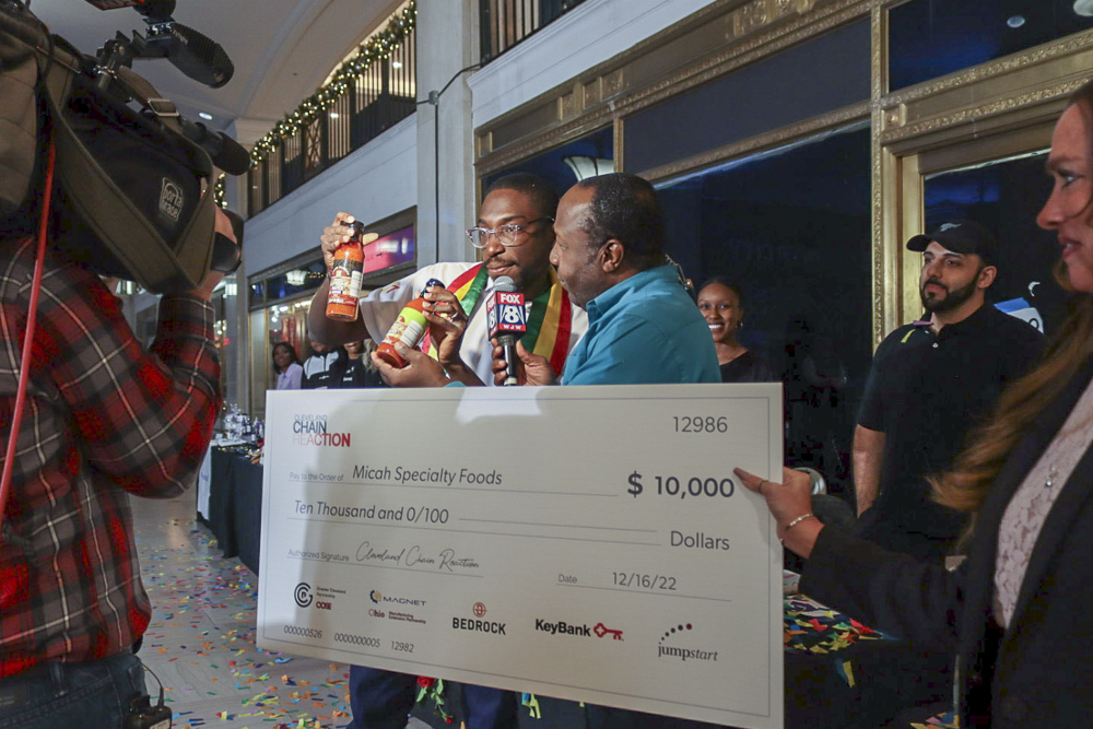 Nana Kwamena Takyi-Micah (Left), owner of Micah Specialty Foods, a second-place winner of season five of Cleveland Chain Reaction, with Kenny Crumpton of FOX 8