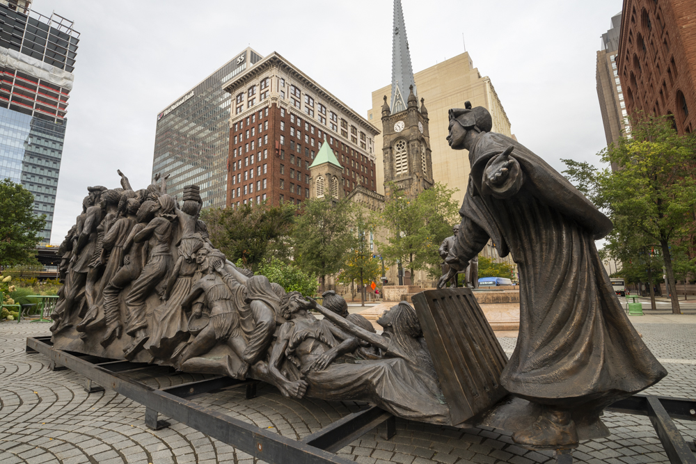 “Let The Oppressed Go Free” by artist Timothy Schmalz