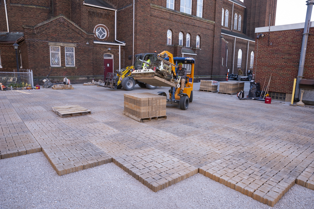 Permeable pavers in a parking being laid down at St. Casimir Church