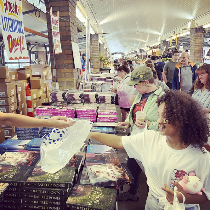 Book give away at the West Side Market