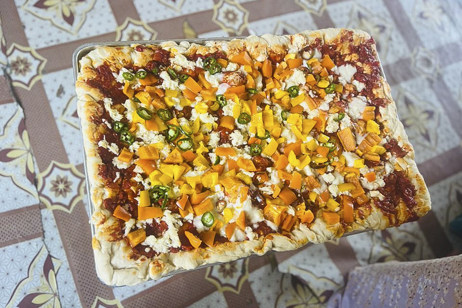 Brandon cooking with the villagers in Ali Adde