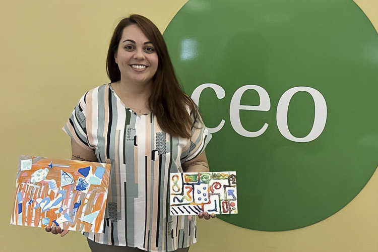 Art therapist showing some of the artwork formerly incarcerated folks created