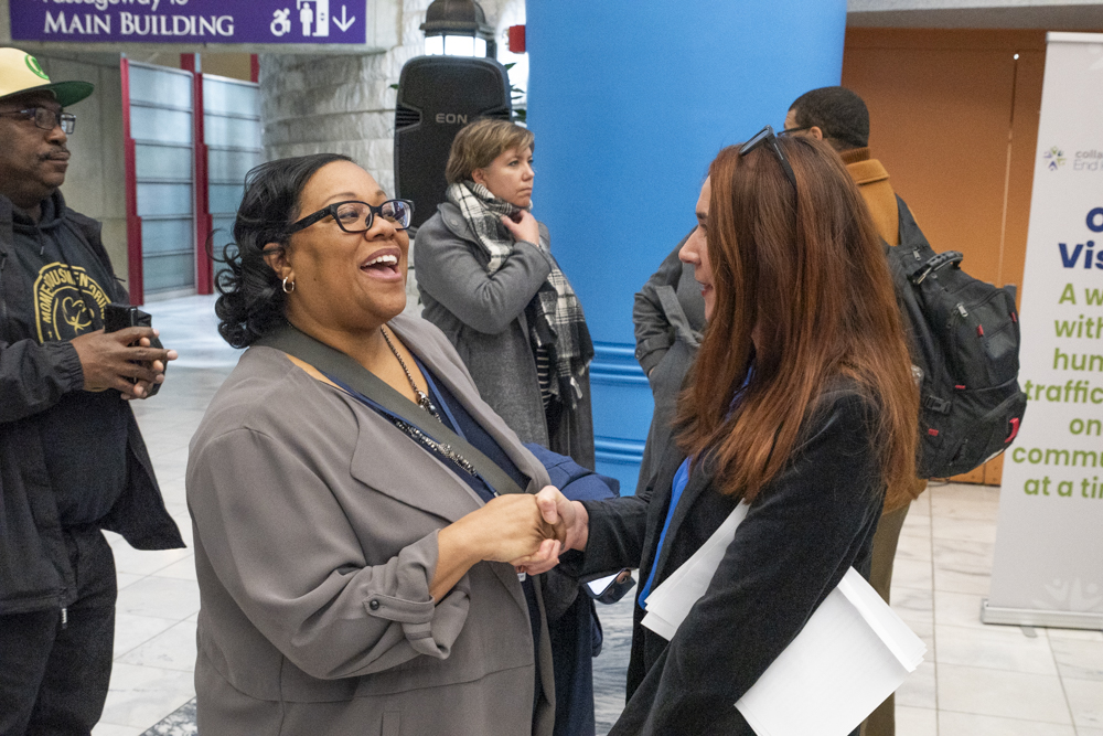 Sabrina Roberts, Advisor to County Executive Chris Ronayne (left) speaking with Kirsti Mouncey