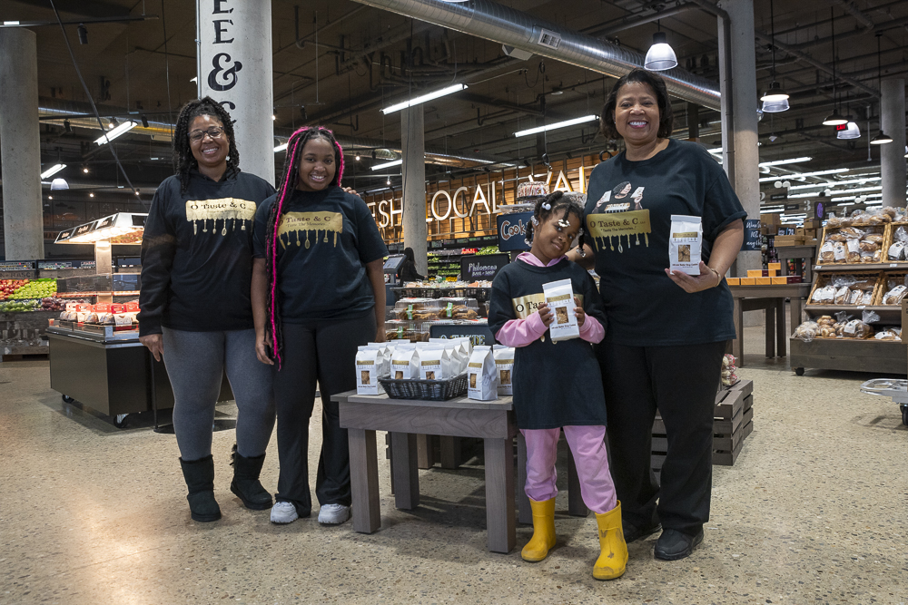 Charlene Peachie Tufts (right) of O Taste & C with daughter Tosalyn, and granddaughters Harmoni and Lyrie at Meijer Fairfax Market