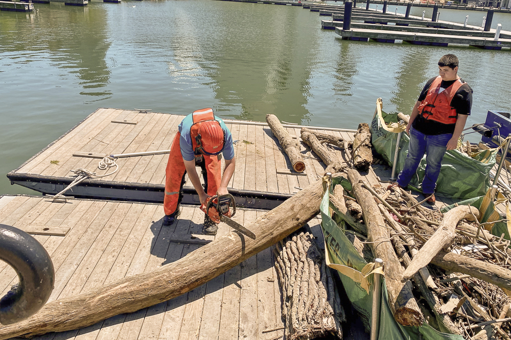 Using chainsaws to make the debris more manageable