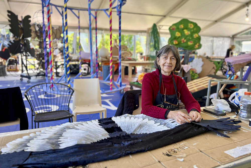 Artists, volunteers, and parade participants putting the final touches on the costumes, puppets, and floats for this year’s Parade the Circle “Visions of Harmony”
