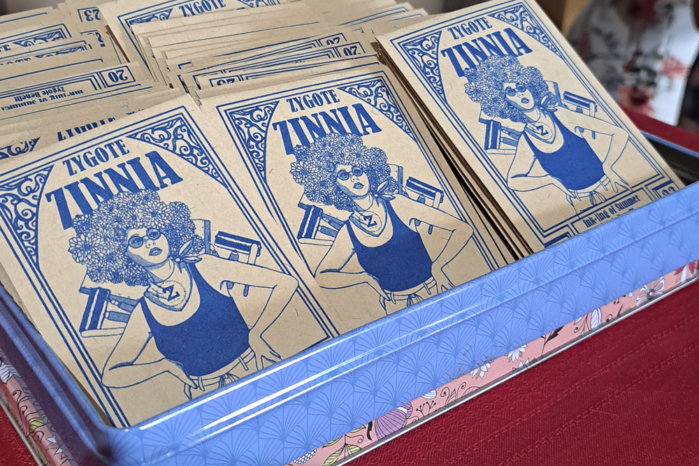 A box of Zygote Zinnia packets—an annual giveaway at the benefit—awaits the arrival of guests in 2023