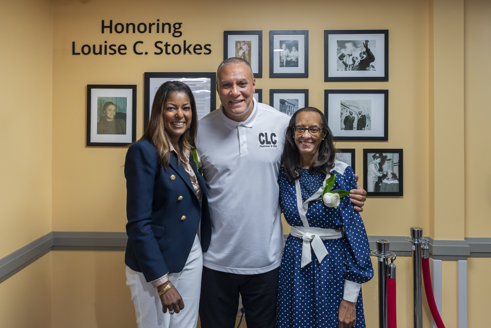 (From left to right) Lori Stokes, Cordell Stokes and Angela Stokes in front of the exhibit honoring their grandmother