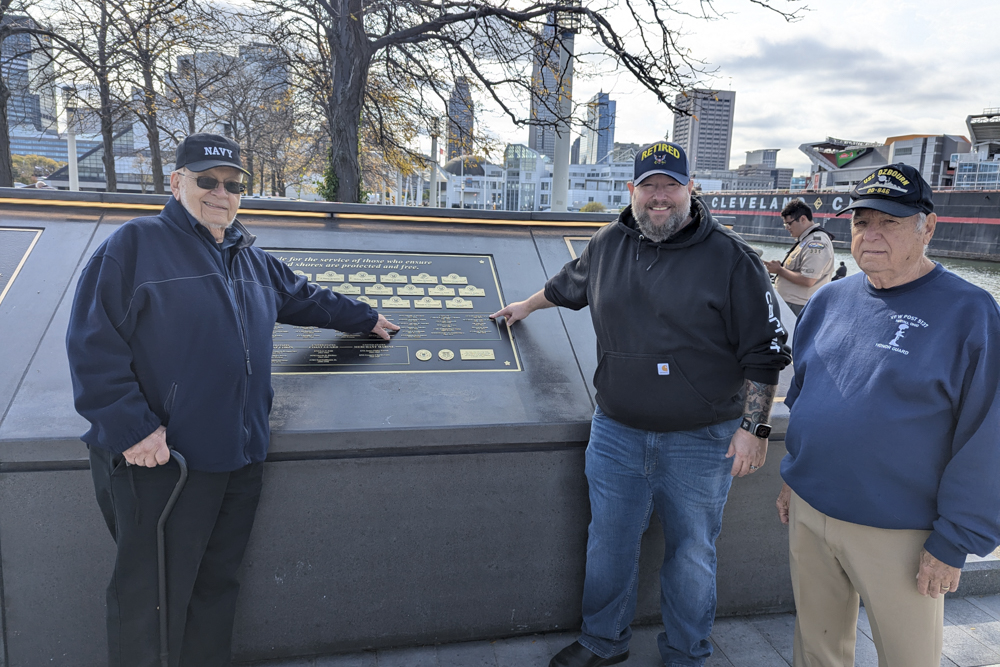 Local veterans point to their names on the honor wall at Lone Sailor Plaza. L to R: SH3 Thomas A. Smrdel, AE1(AW) Wayne Varisco, David Varisco