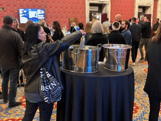 A guest at CIFF49 opening night grabs some popcorn