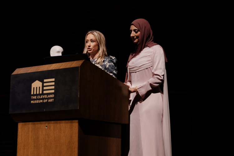 Charlotte Gouveia, standing past president of Column & stripe and Aimon Ali:, chair of Art of Fashion, Column & Stripe board member, and Founder of Fashion Talks Foundation