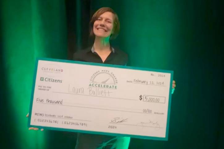 Laura Balliett receives her $5,000 prize during Accelerate 2024.