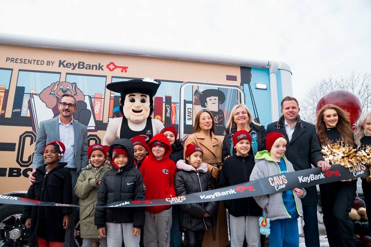 Representatives from Rock Entertainment Group, KeyBank, and Cleveland Kids' Book Bank  cut the ribbon on the Cavs Book Bus.