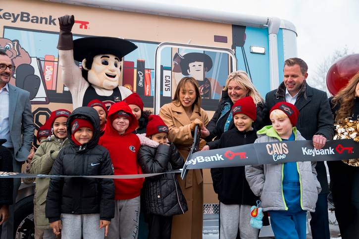 Representatives from Rock Entertainment Group, KeyBank, and Cleveland Kids' Book Bank  cut the ribbon on the Cavs Book Bus.