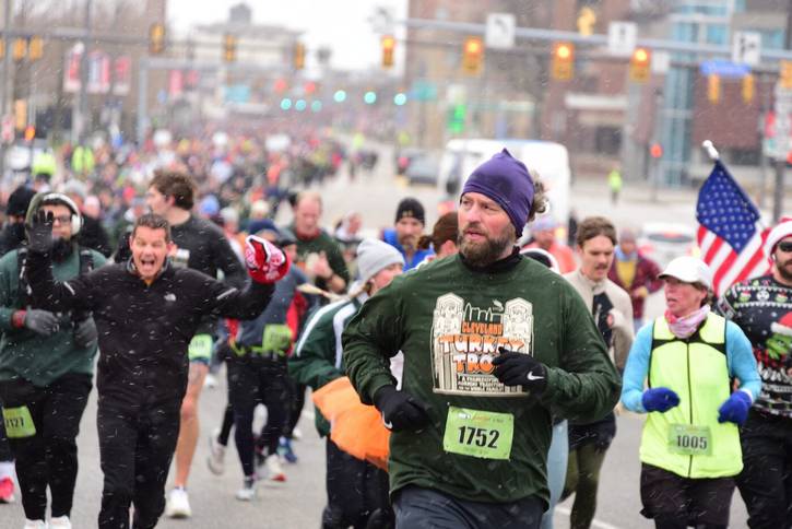 Beth Sersig, right in yellow, was the top finisher in the women, ages 65-69 category for the 5-Mile race.