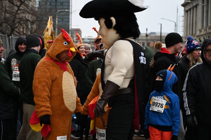 The Turkey and the Cleveland Cavaliers' Sir C.C. hanging out at the 44th annual Turkey Trot