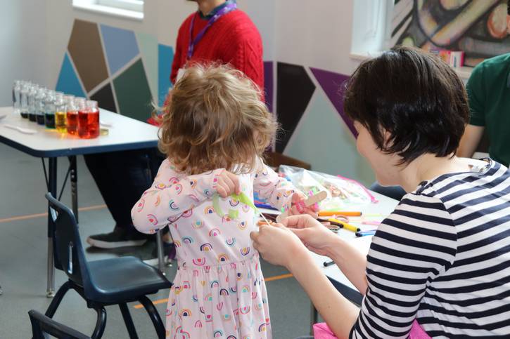 A parent and child bond during a recent STEAM Saturdays at the Music Settlement, where kids participate in a variety of hands-on activities.