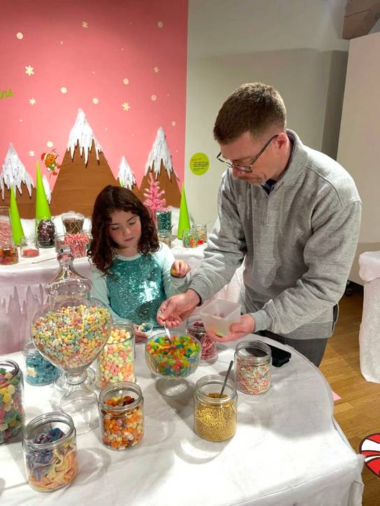 Guests choose their decorations at The Jolly Gingerbread Makery Pop-Up Workshop.