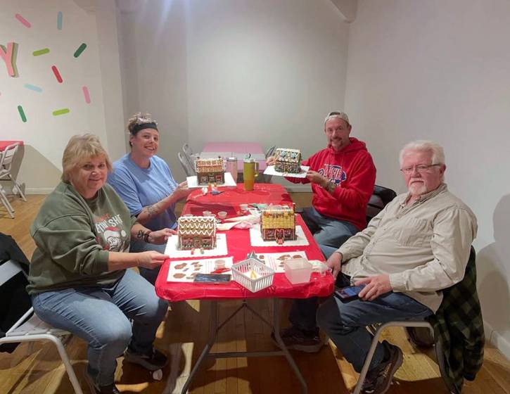 Guests enjoying a workshop at The Jolly Gingerbread Makery Pop-Up Workshop at 78th Street Studios.