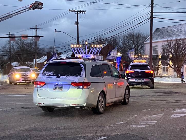 The Light After Dark Menorah Parade.