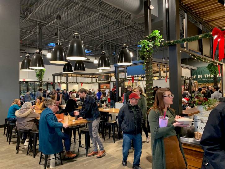 The Holiday Market brings together local art, food, and makers in a cozy indoor setting at the Van Aken District.