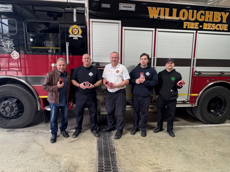 Willoughby Hills Fire Department Chief Robert Gandee (middle) stands with his crew.