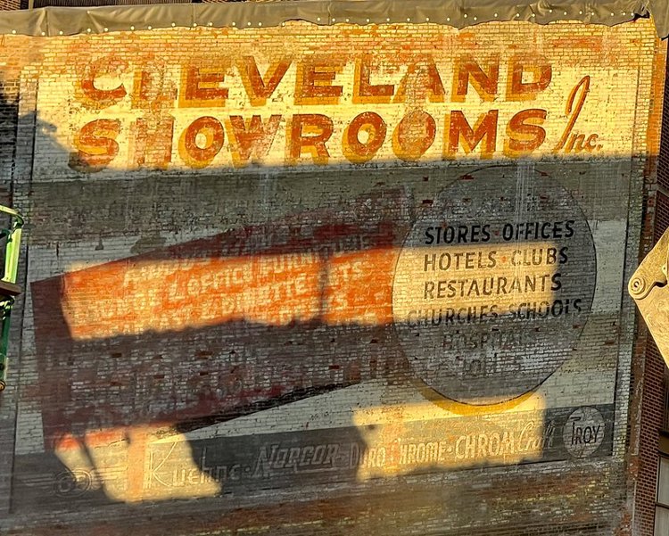 Cleveland Showrooms sign revealed 2023 after garage demolition on Huron Road at E. 6 St.