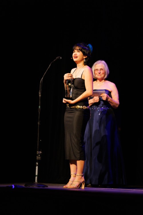 Cahalane accepts her Best Actress award for her role as Hermes in Hadestown at Hudson High.