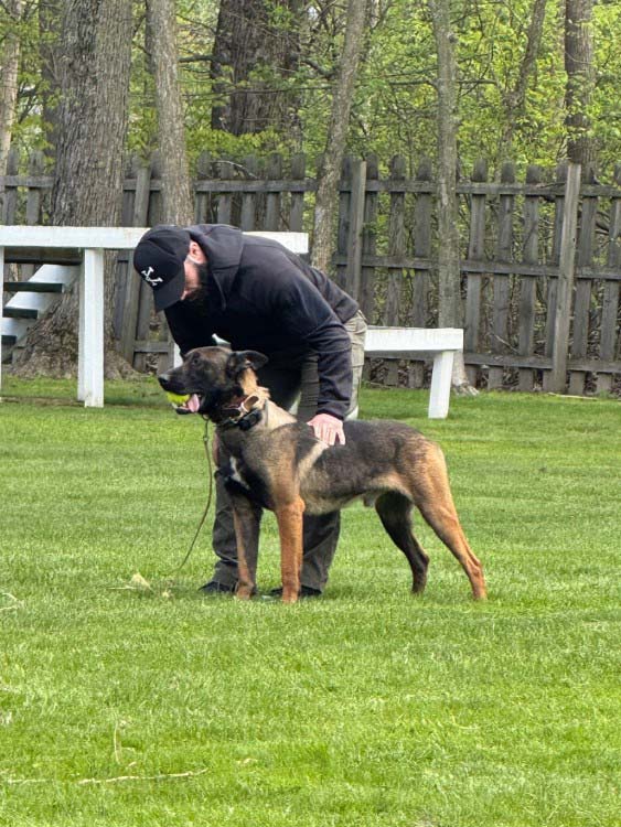 Officer Jeremy Puszakowski and K-9 Chinook at Excel K-9 Services training facility.