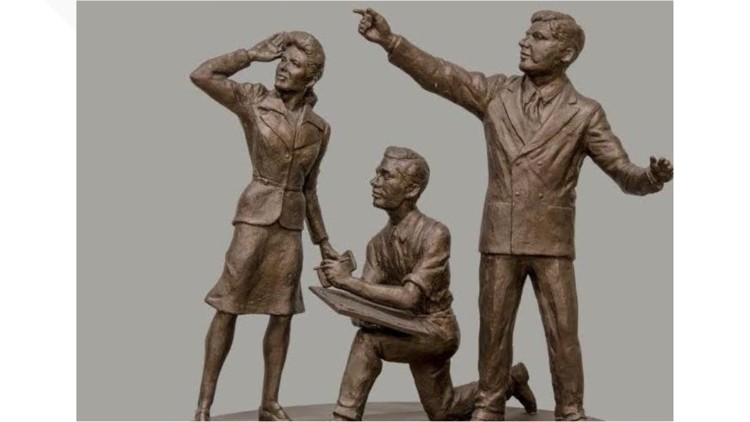 Models of bronze statues of Jerry Siegel, Joanne Siegel, and Joe Shuster, which was unveiled in 2025 at the Siegel & Shuster Superman Plaza.