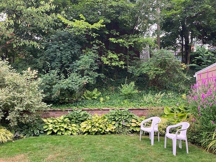 A backyard garden wall on Meadowbrook Road.