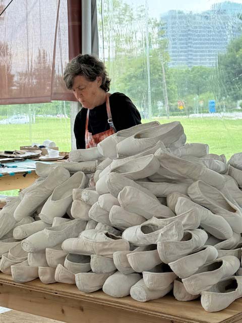 Volunteer Katie Lee helping Cleveland Ballet's Alessander Guzman