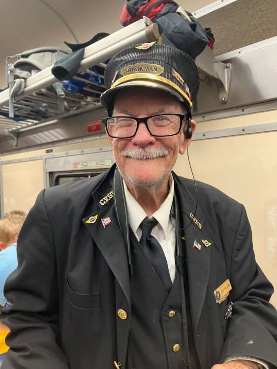 Cuyahoga Scenic Railroad volunteer Jack Williams in the coach car