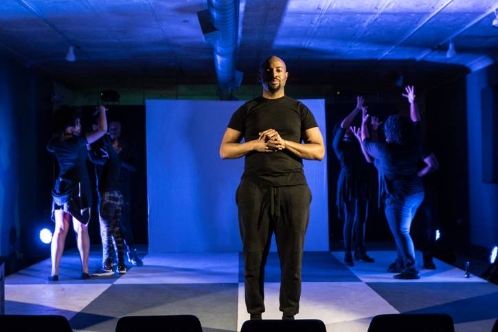 Nathan Tolliver and the ensemble in the 2017 'Objectively/Reasonable' revival.