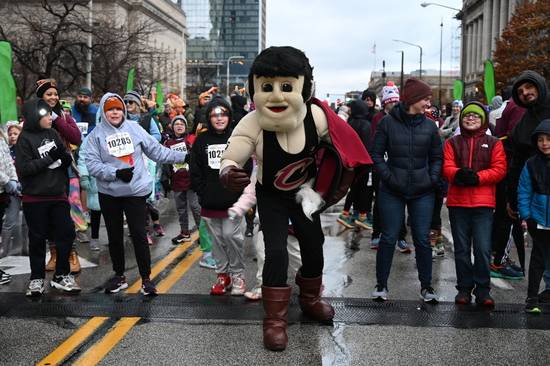 The Cavs' Sir C.C. helps get the Turkey Trot started.