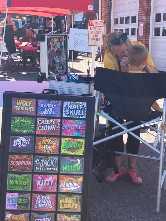 Face painting was one of the children's activities at the University Heights Fire Department open house during Fire Prevention Week.