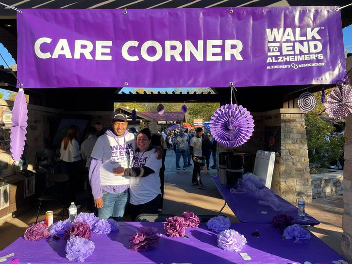 Walk volunteers Deloum and Lexi help out in the Alzheimer's Association's Care Corner.