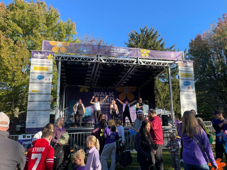 Volunteers entertain on stage during the 2025 Walk to End Alzheimer's