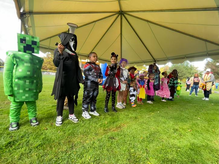 Folks line up to show off their costumes in the costume contest, competing for a $250 prize.