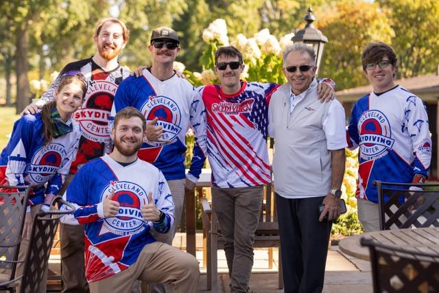 The skydivers pose with VFR Foundation president and founder  Dave Knott