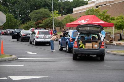 Cars line up at a Cuyahoga County Pubilic Library branch during a monthly food distribution.