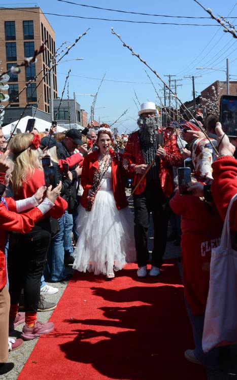DJ Kishka walls bride Becki Locke down the aisle.