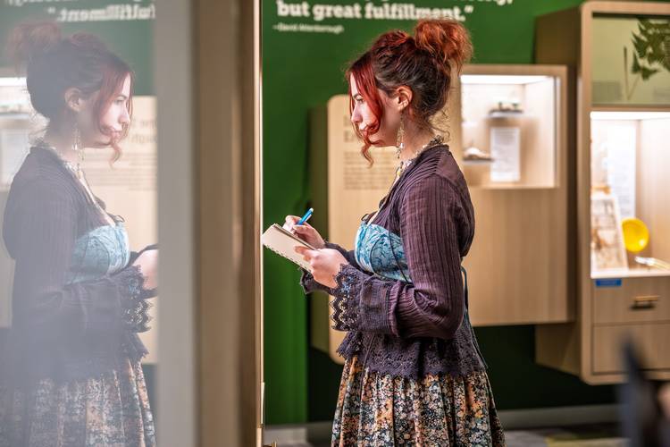 A student sketches during the KSU School of Fashion avian biomimicry project.