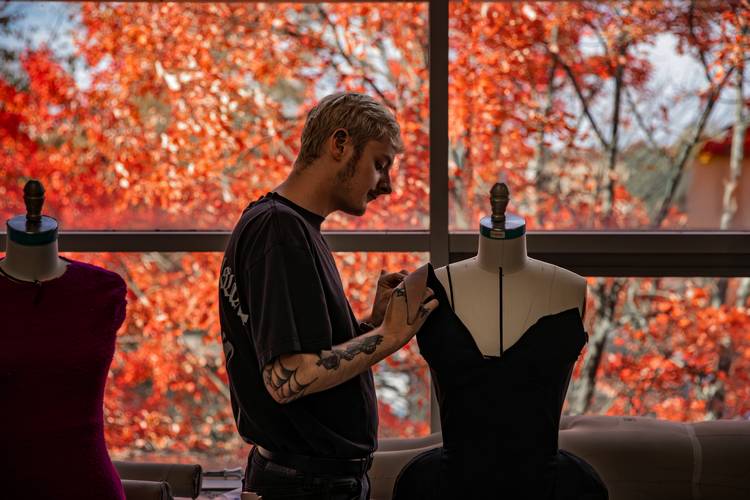 A student inspects his design.